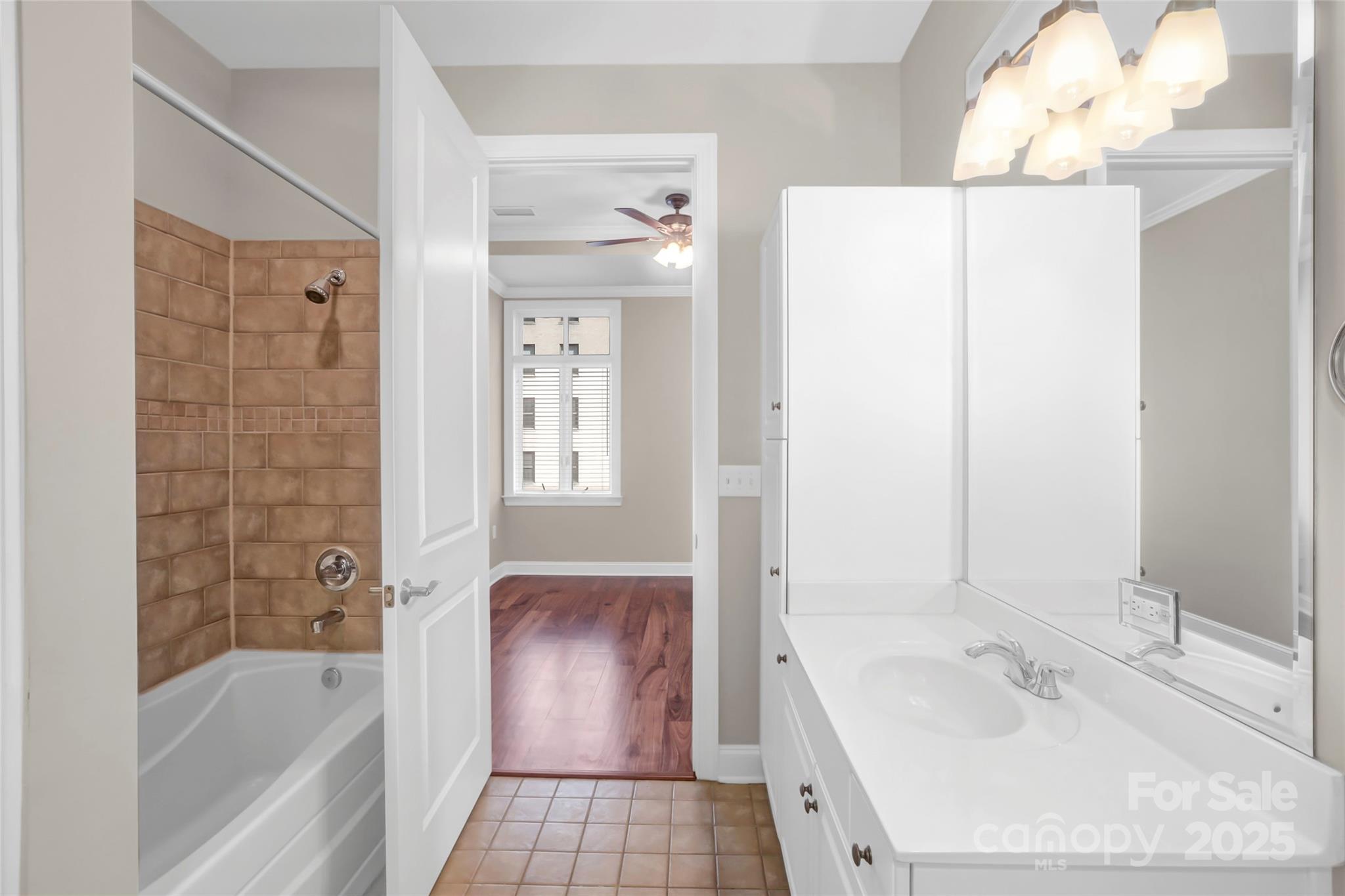 230 South Tryon Street, Unit 603 Charlotte, NC 28281 - Photo 31 of 32 a bathroom with a tub sink and mirror
