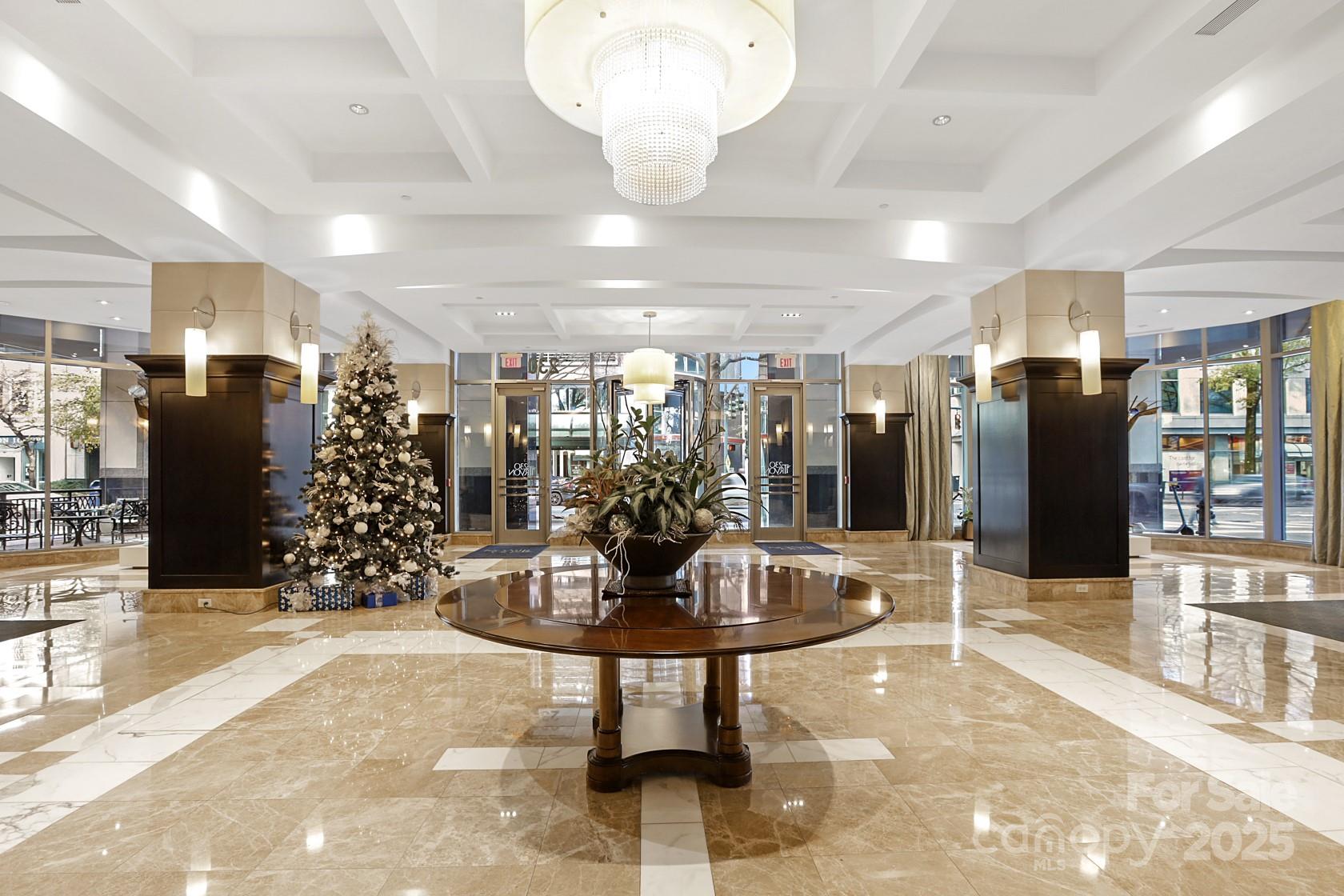 230 South Tryon Street, Unit 603 Charlotte, NC 28281 - Photo 9 of 32 a view of a lobby with gym equipment