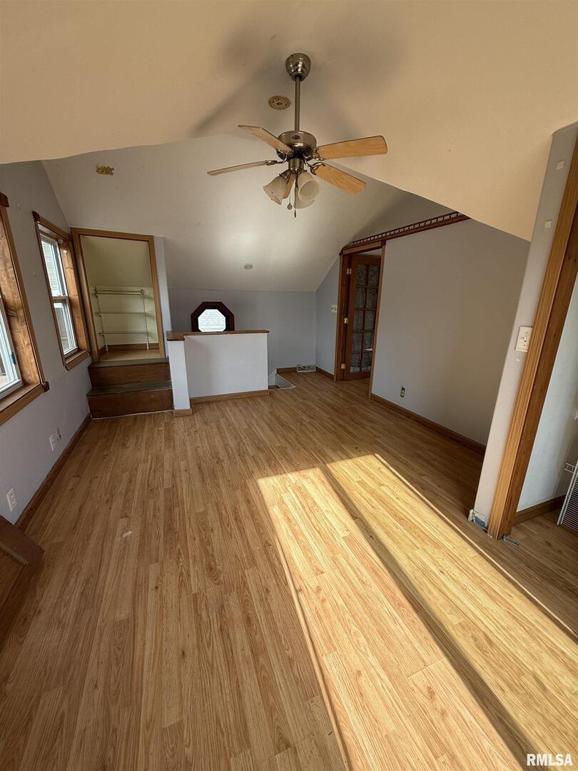 237 1st Avenue Clinton, IA 52732 - Photo 10 of 21 a bedroom with a bed and a large window