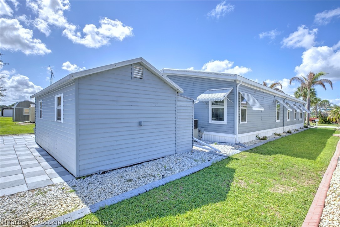 2702 Rodney Street Sebring, FL 33872 - Photo 28 of 33 a view of a house with a yard
