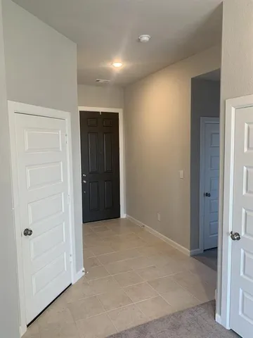 an empty room with closet area