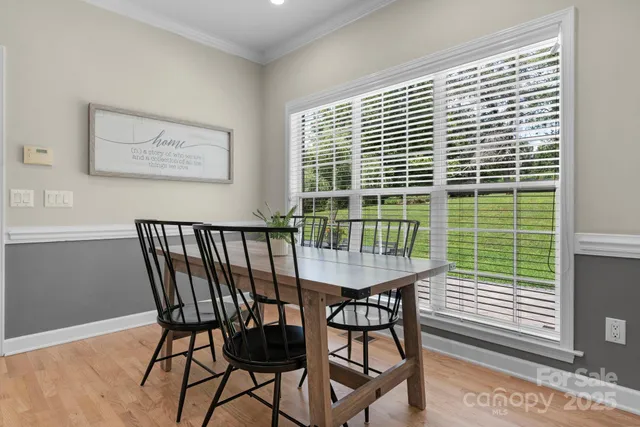 a balcony with table and chairs