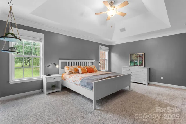 a bed room with a bed and a chandelier