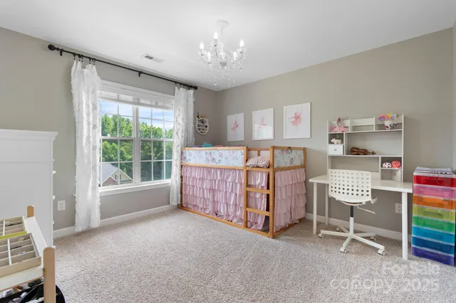 a bedroom with furniture and a window