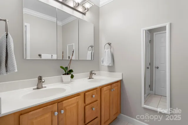 a bathroom with a sink double vanity and shower