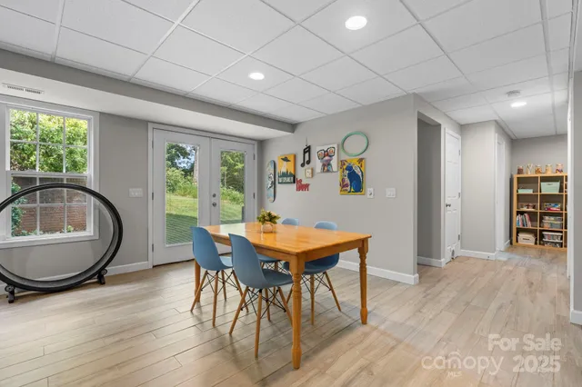 a view of a dining room with furniture and a window