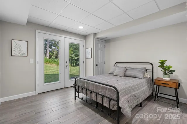 a bedroom with a large bed and a window