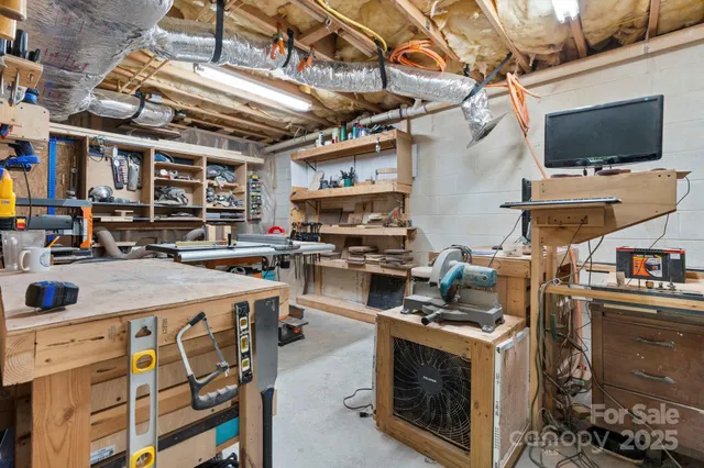 a open kitchen with stainless steel appliances granite countertop a stove and a sink with cabinets