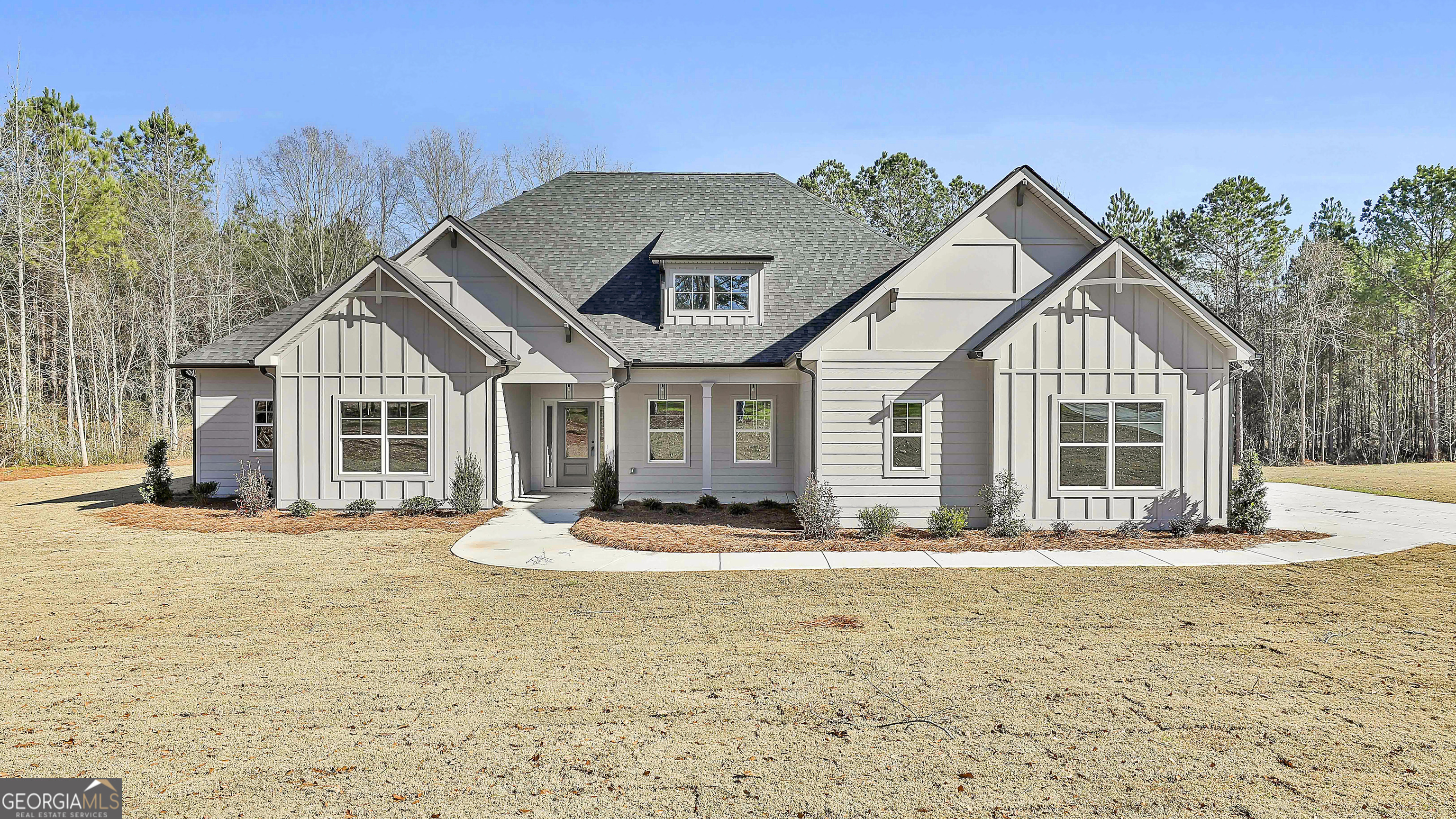 a front view of a house with a yard