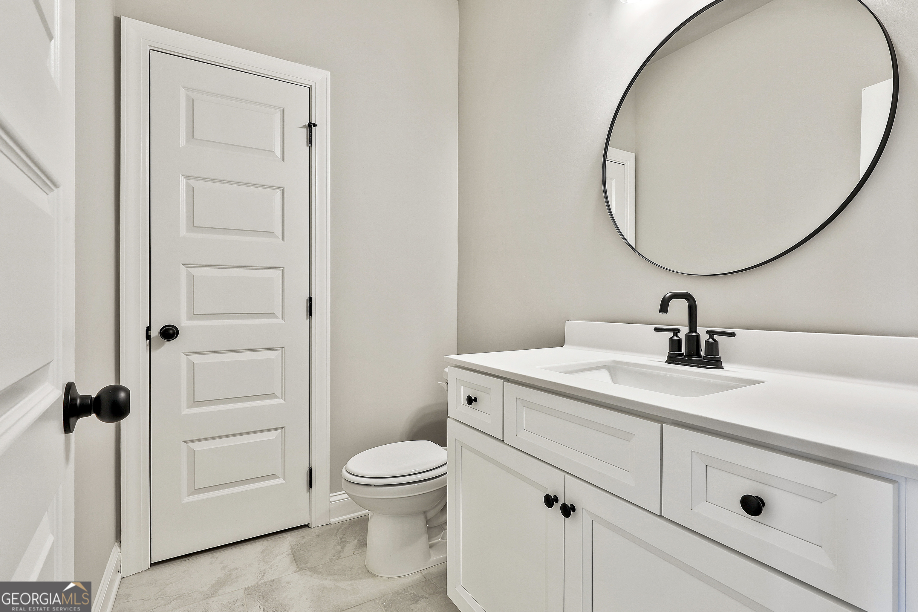 757 Alex Stephens Road Moreland, GA 30259 - Photo 18 of 45 a bathroom with a sink a toilet and a mirror