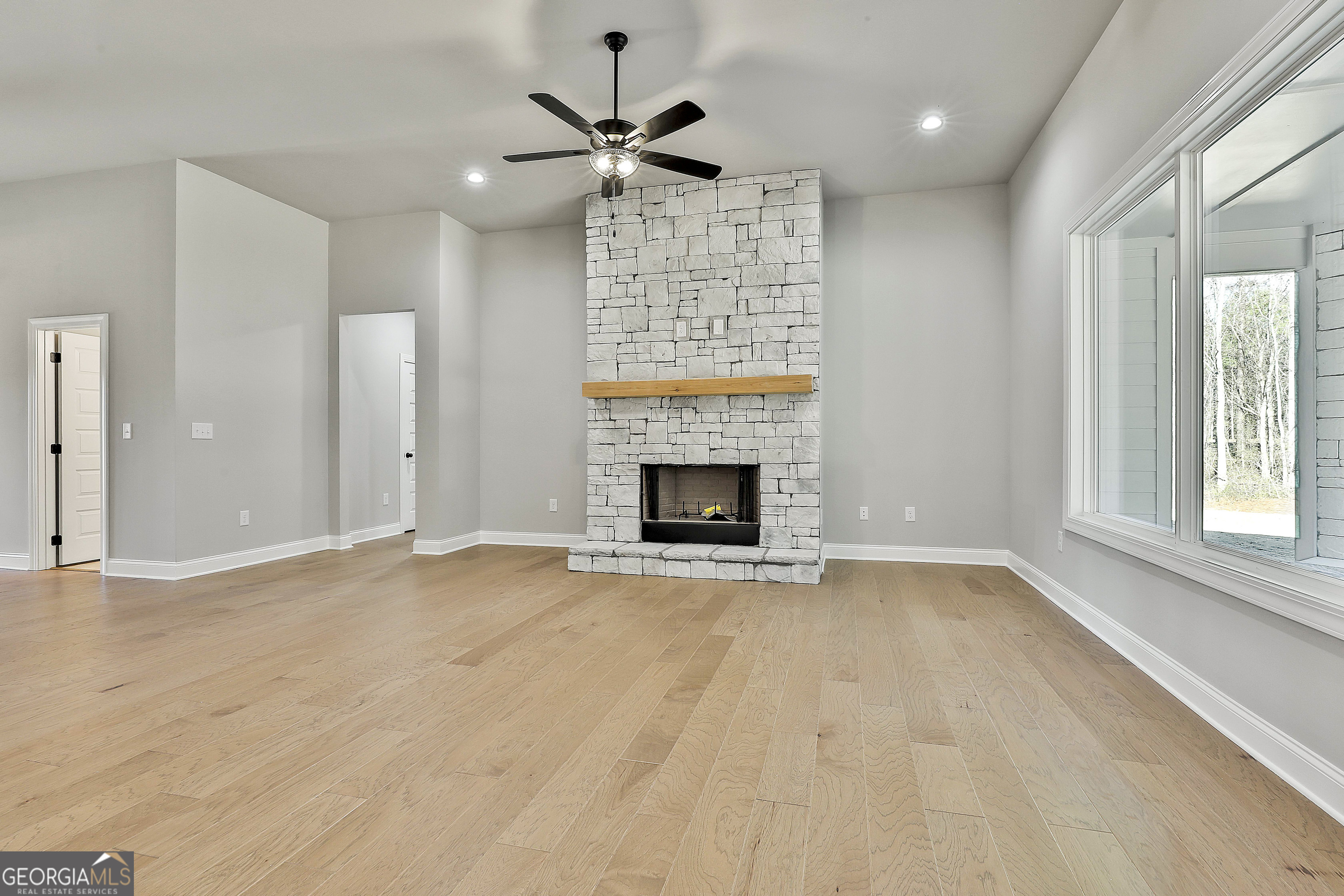 757 Alex Stephens Road Moreland, GA 30259 - Photo 20 of 45 an empty room with windows and fireplace