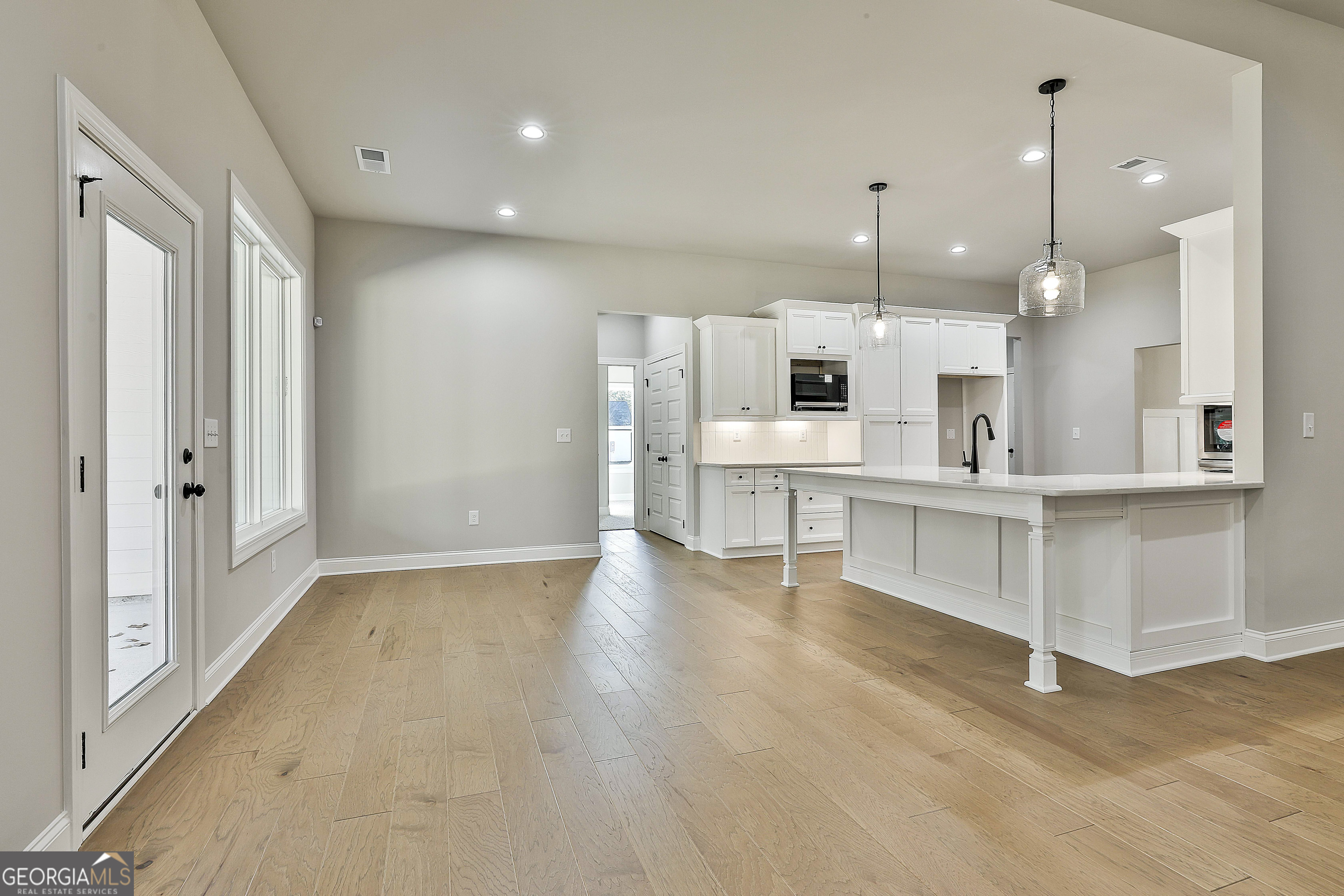 757 Alex Stephens Road Moreland, GA 30259 - Photo 23 of 45 a view of kitchen with kitchen island white cabinets and refrigerator