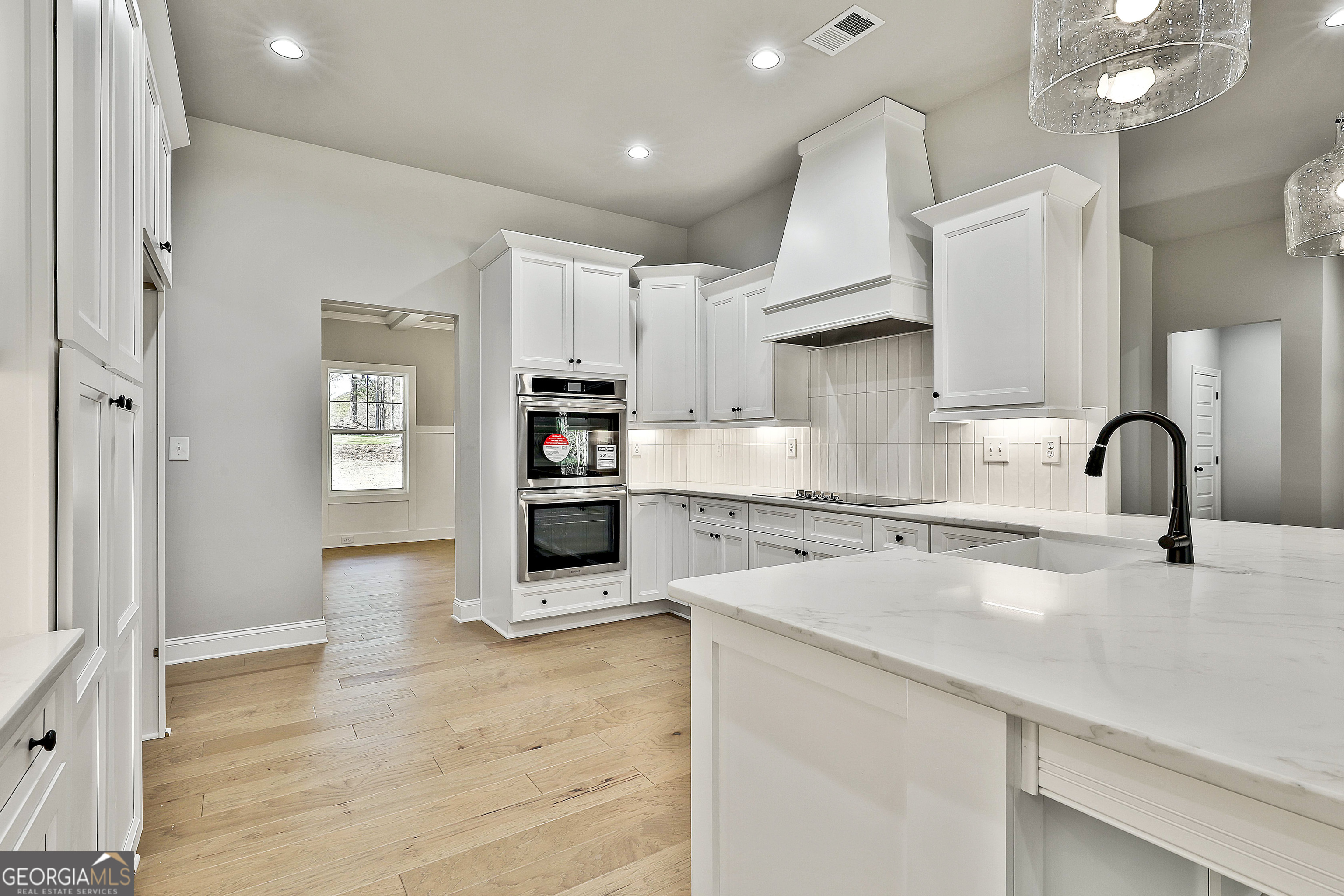 757 Alex Stephens Road Moreland, GA 30259 - Photo 26 of 45 a kitchen with kitchen island a counter top space a sink stainless steel appliances and cabinets