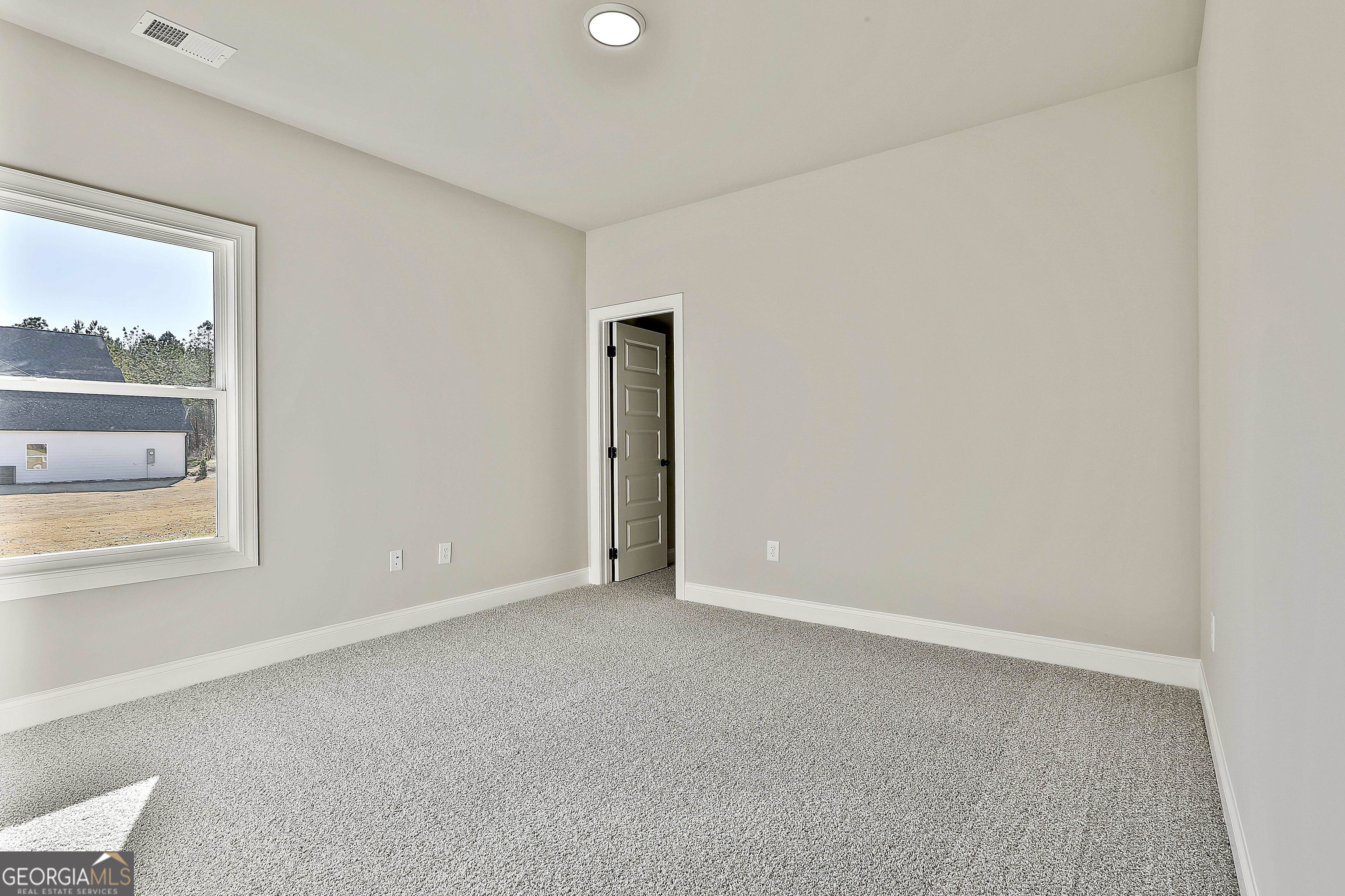 757 Alex Stephens Road Moreland, GA 30259 - Photo 35 of 45 a view of an empty room with a window