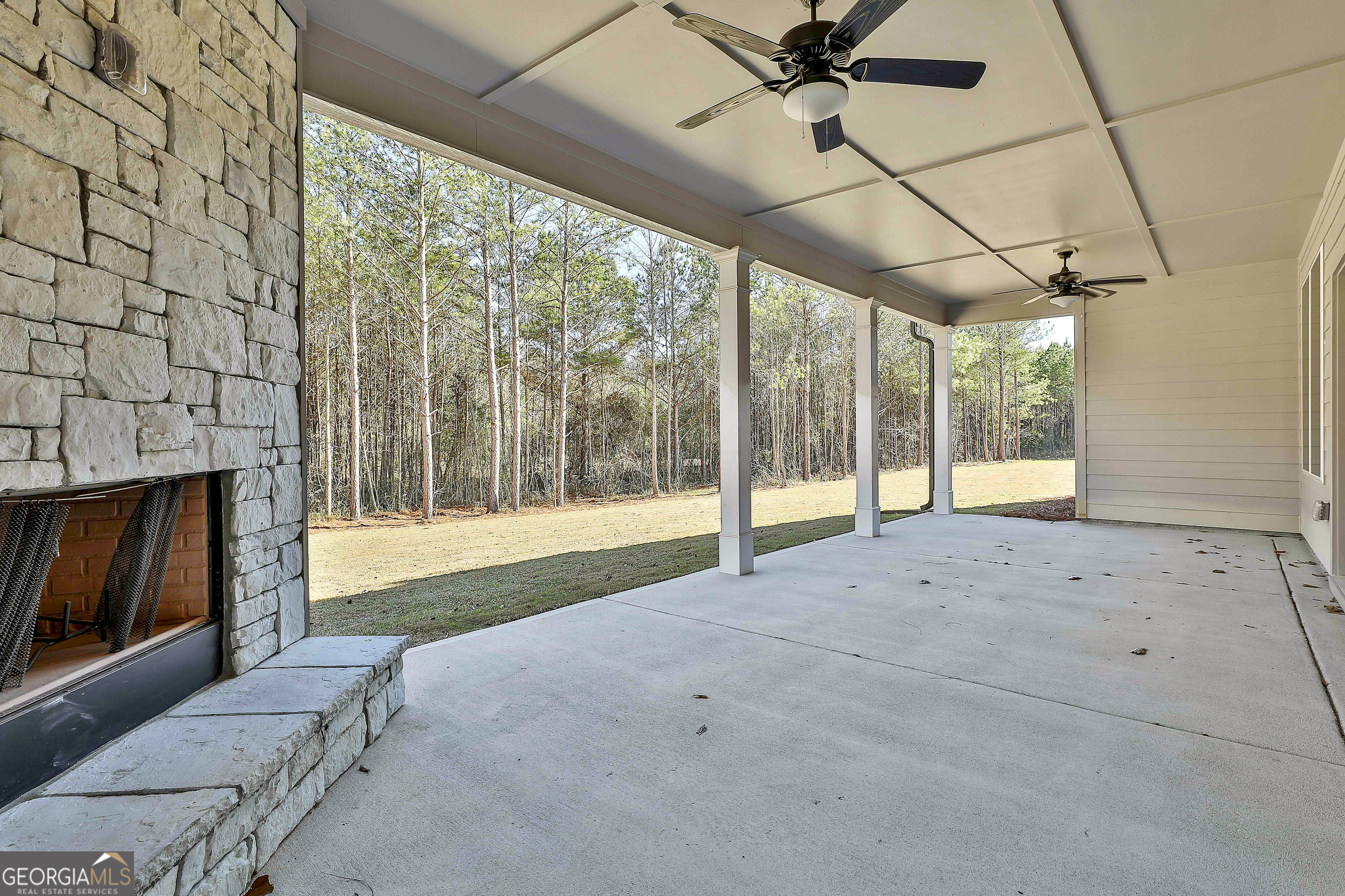 757 Alex Stephens Road Moreland, GA 30259 - Photo 43 of 45 a view of an empty room with a fireplace and a window
