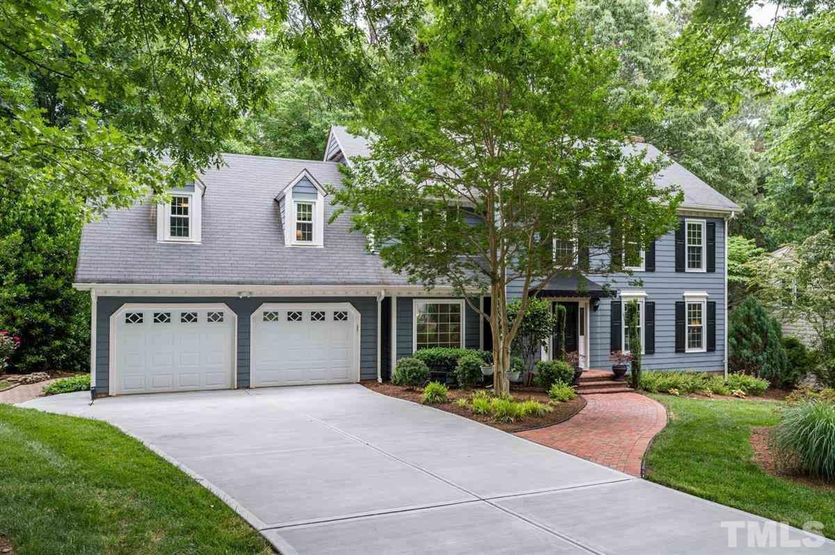 7916 Sutterton Court Raleigh, NC 27615 - Photo 2 of 25 a front view of a house with a yard and garden