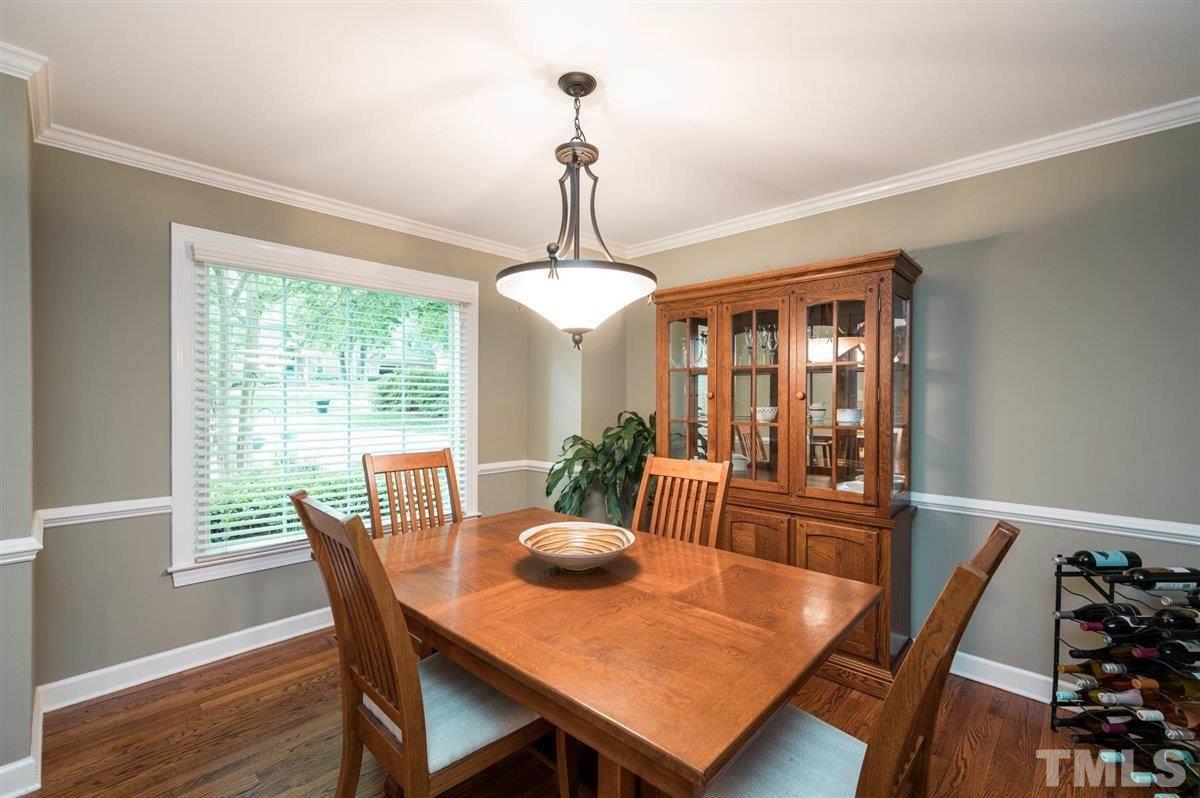 7916 Sutterton Court Raleigh, NC 27615 - Photo 12 of 25 a view of a dining room with furniture window and outside view