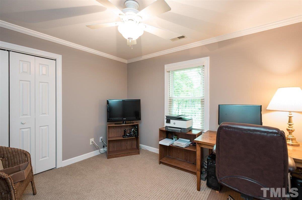 7916 Sutterton Court Raleigh, NC 27615 - Photo 17 of 25 a view of a livingroom with workspace and a window
