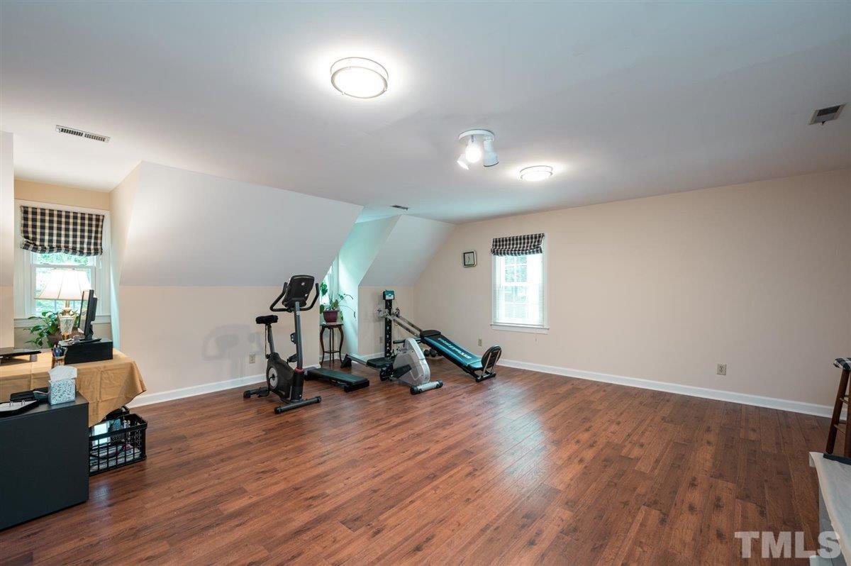 7916 Sutterton Court Raleigh, NC 27615 - Photo 19 of 25 a view of a room with gym equipment