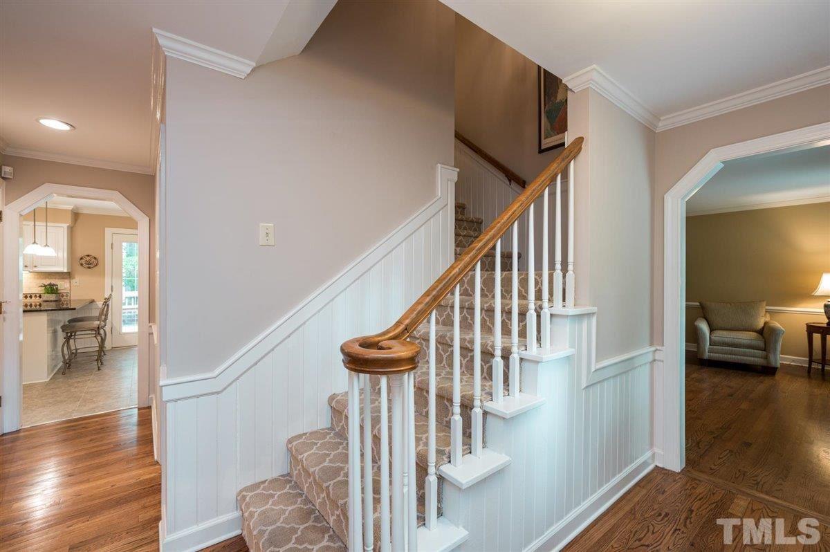 7916 Sutterton Court Raleigh, NC 27615 - Photo 3 of 25 a view of entryway and hall with wooden floor