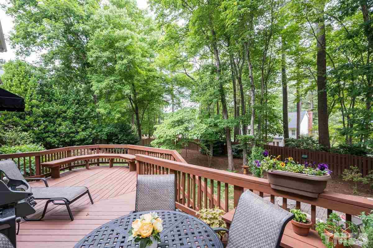 7916 Sutterton Court Raleigh, NC 27615 - Photo 21 of 25 a view of balcony with furniture and trees