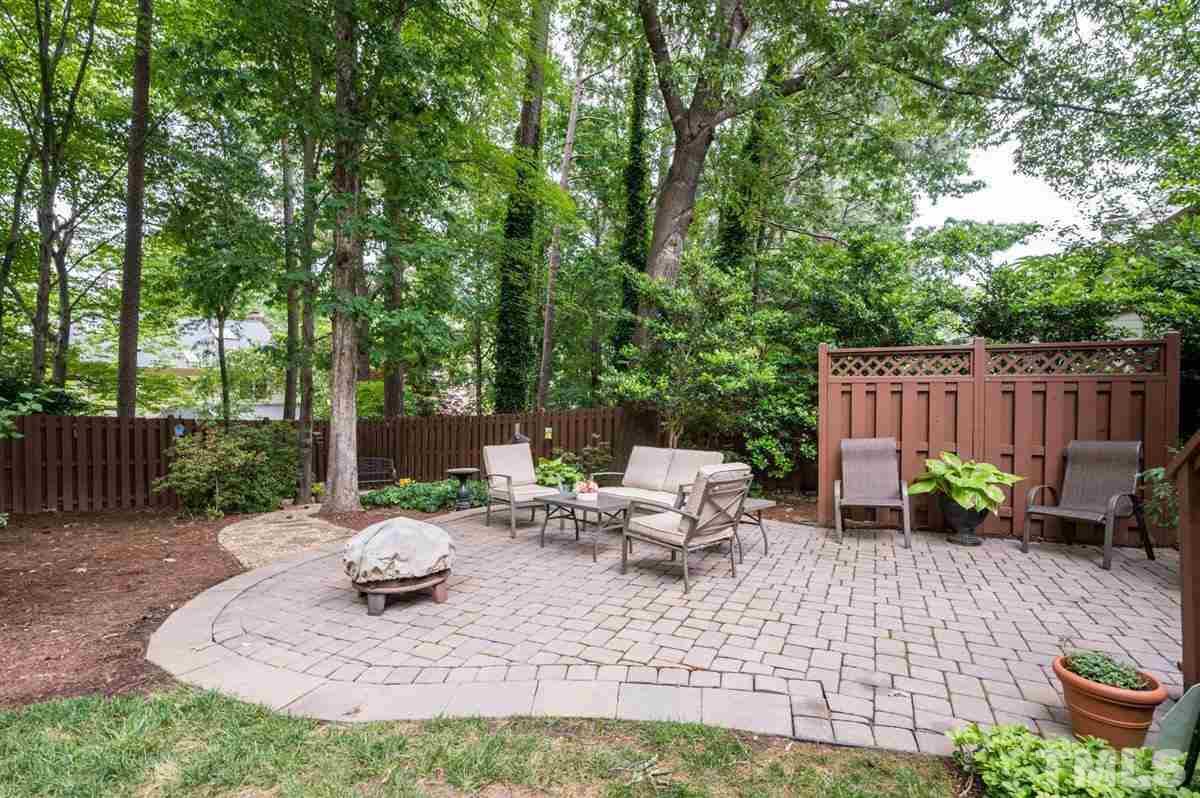 7916 Sutterton Court Raleigh, NC 27615 - Photo 23 of 25 a view of backyard with furniture and garden
