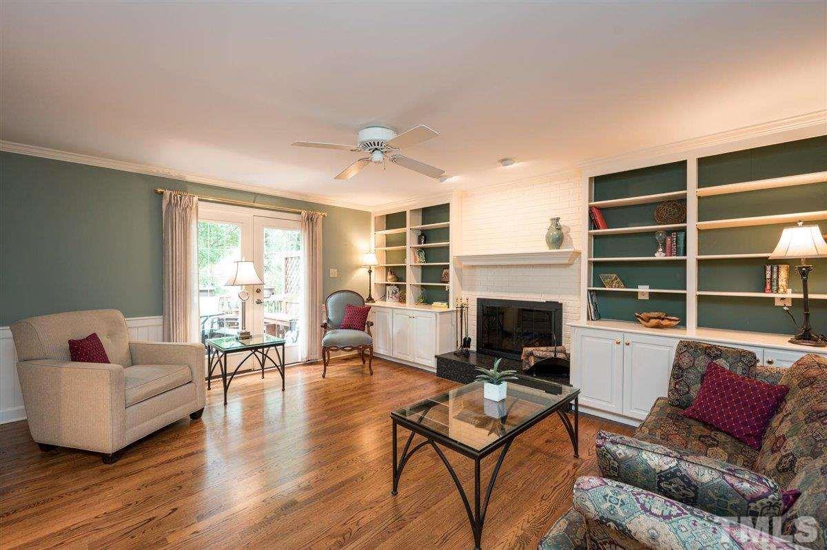 7916 Sutterton Court Raleigh, NC 27615 - Photo 4 of 25 a living room with furniture fireplace and window