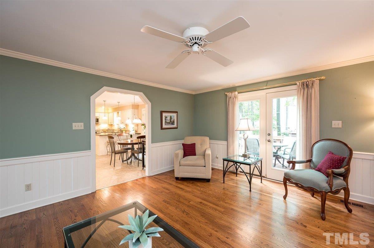 7916 Sutterton Court Raleigh, NC 27615 - Photo 5 of 25 a living room with furniture and wooden floor