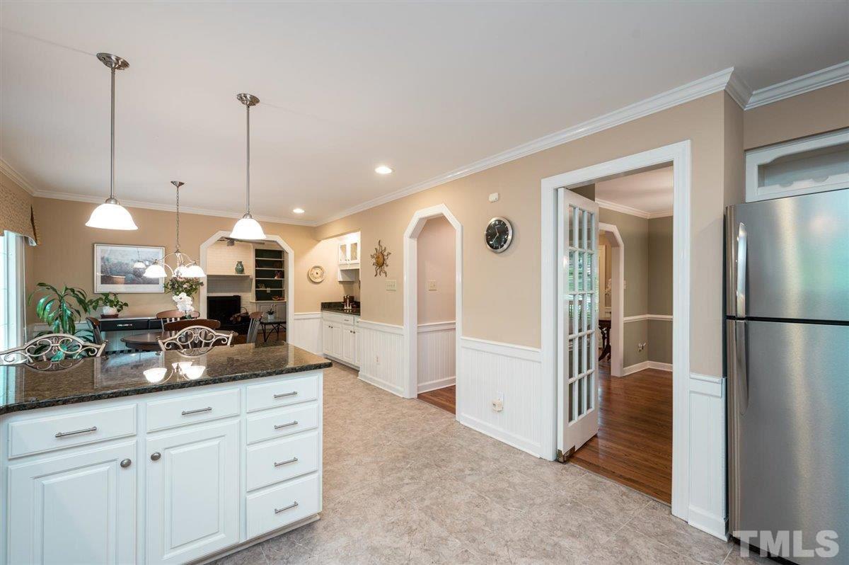 7916 Sutterton Court Raleigh, NC 27615 - Photo 9 of 25 a view of a kitchen and kitchen island