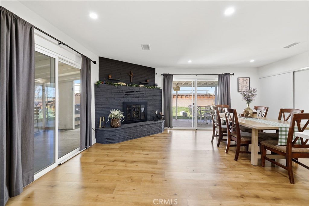 44335 Glenraven Road Lancaster, CA 93535 - Photo 12 of 32 a view of a dining room with furniture window and wooden floor
