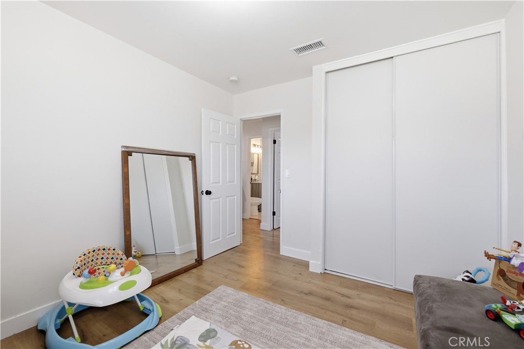 44335 Glenraven Road Lancaster, CA 93535 - Photo 17 of 32 a view of room with toys and wooden floor