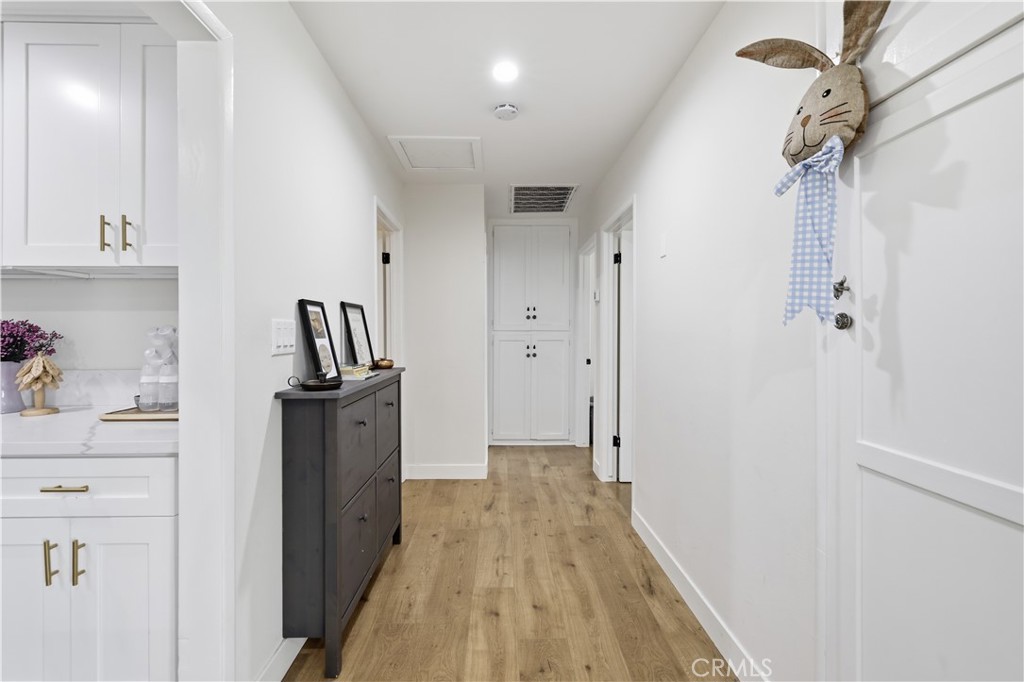 44335 Glenraven Road Lancaster, CA 93535 - Photo 6 of 32 a view of hallway with wooden floor