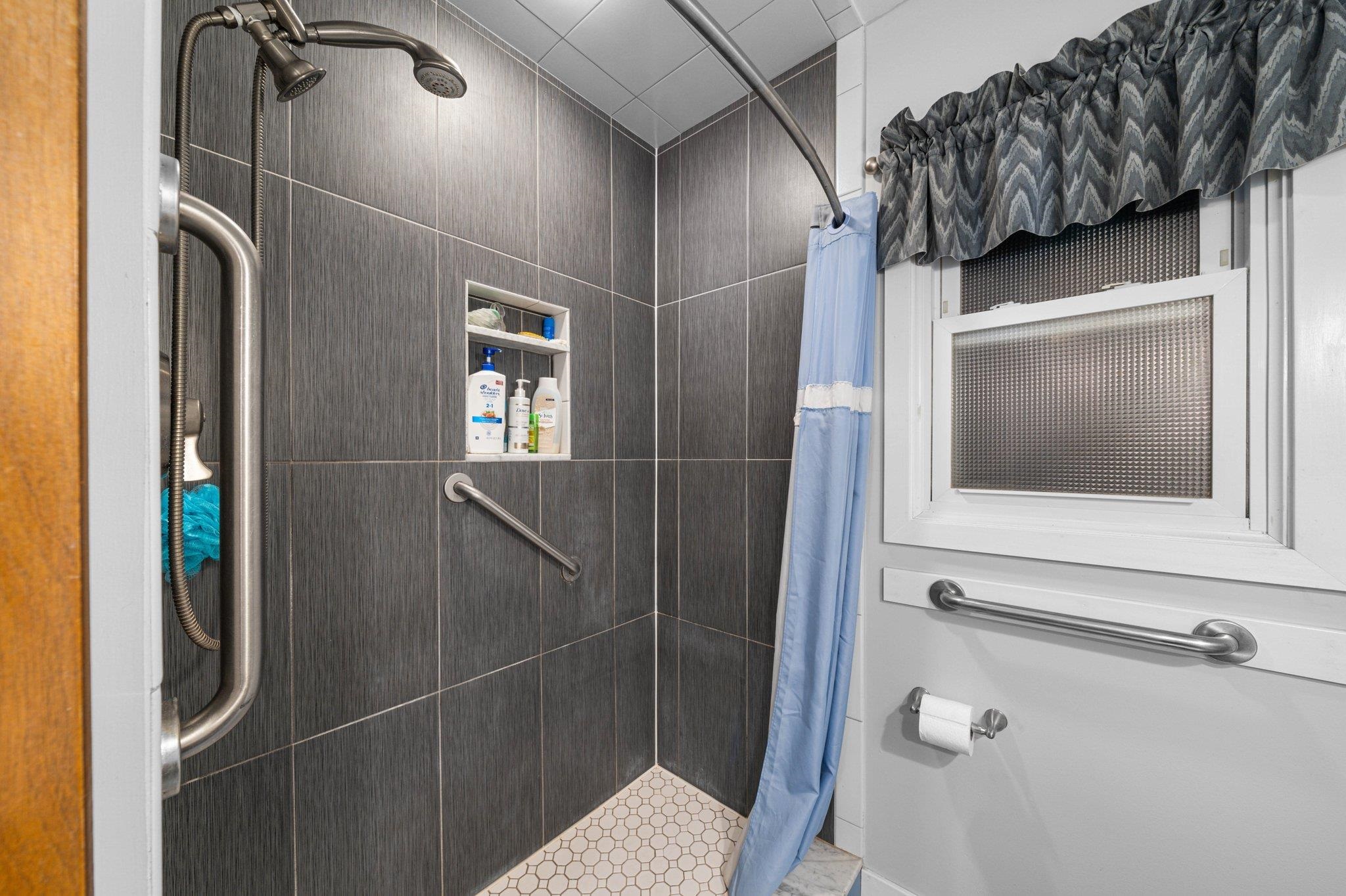 2754 1st Avalon, NJ 08202 - Photo 11 of 26 a bathroom with a walk in closet and wooden floor