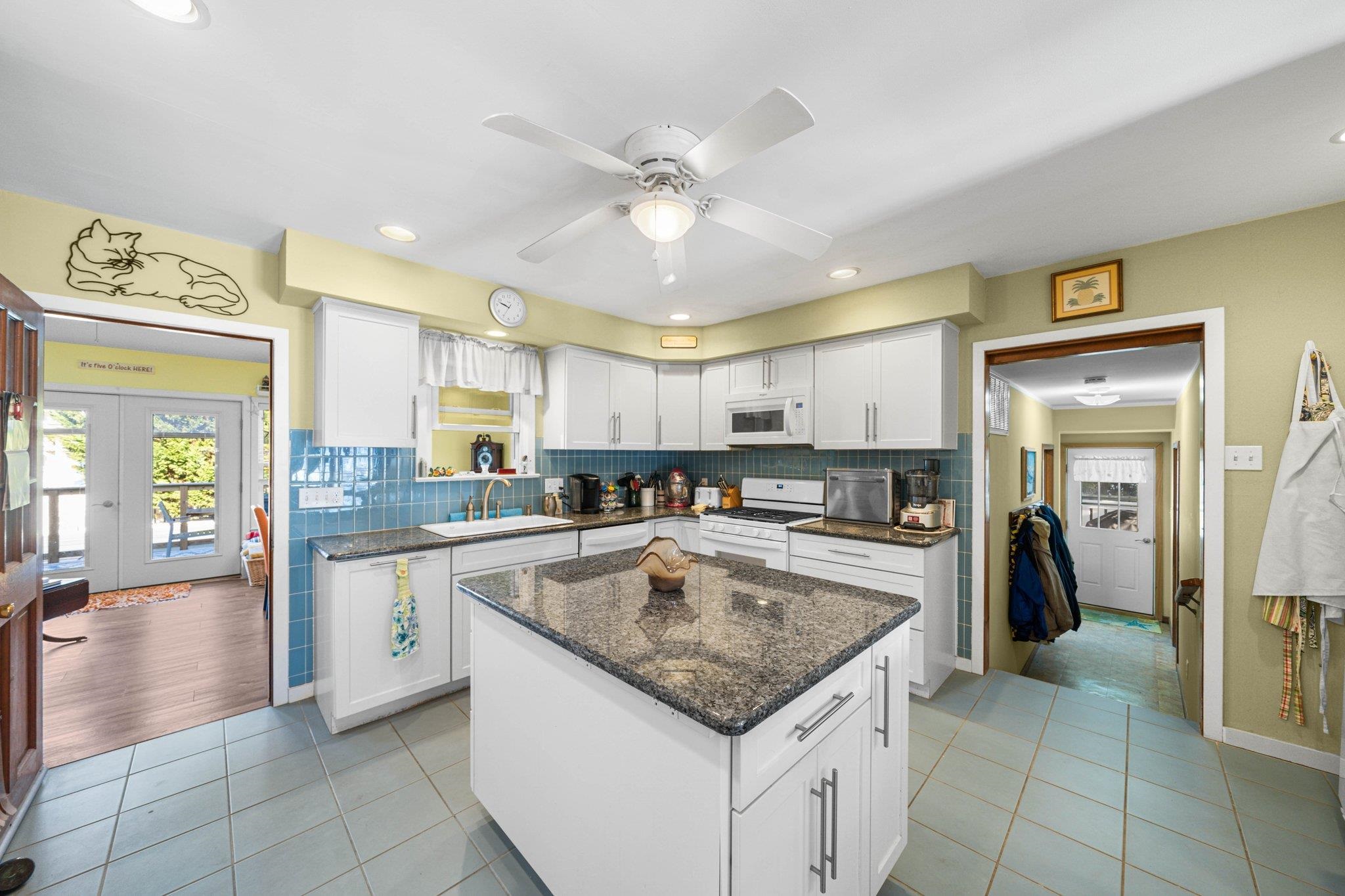 2754 1st Avalon, NJ 08202 - Photo 11 of 26 a kitchen with stainless steel appliances granite countertop a sink and cabinets