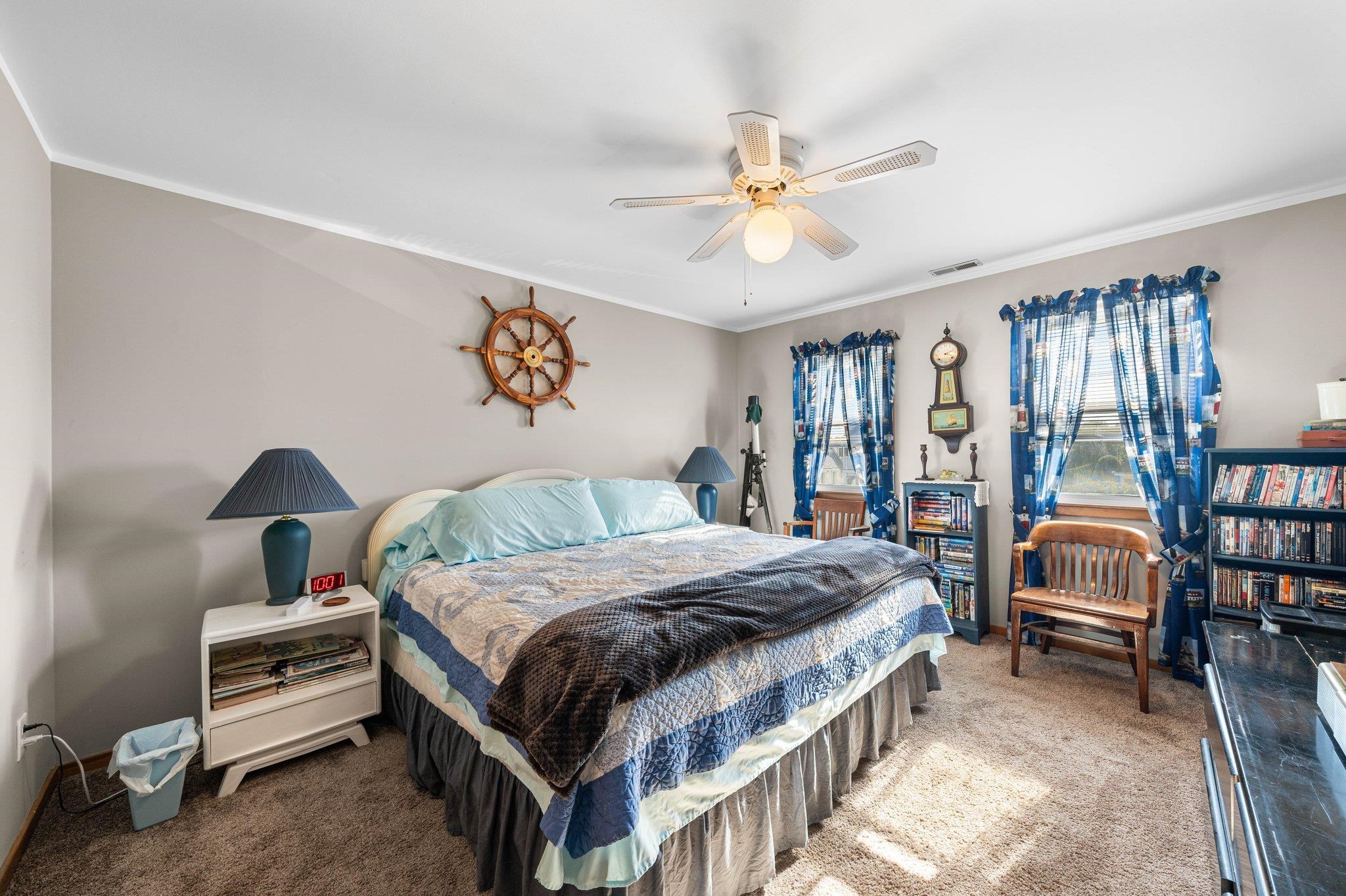 2754 1st Avalon, NJ 08202 - Photo 12 of 26 a bedroom with a bed and a chandelier
