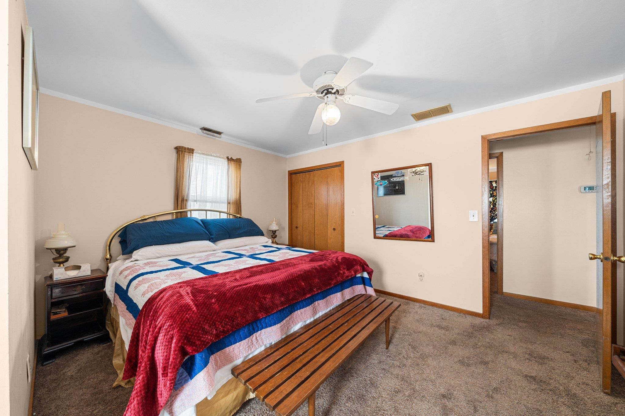 2754 1st Avalon, NJ 08202 - Photo 13 of 26 a bedroom with a bed and a chandelier