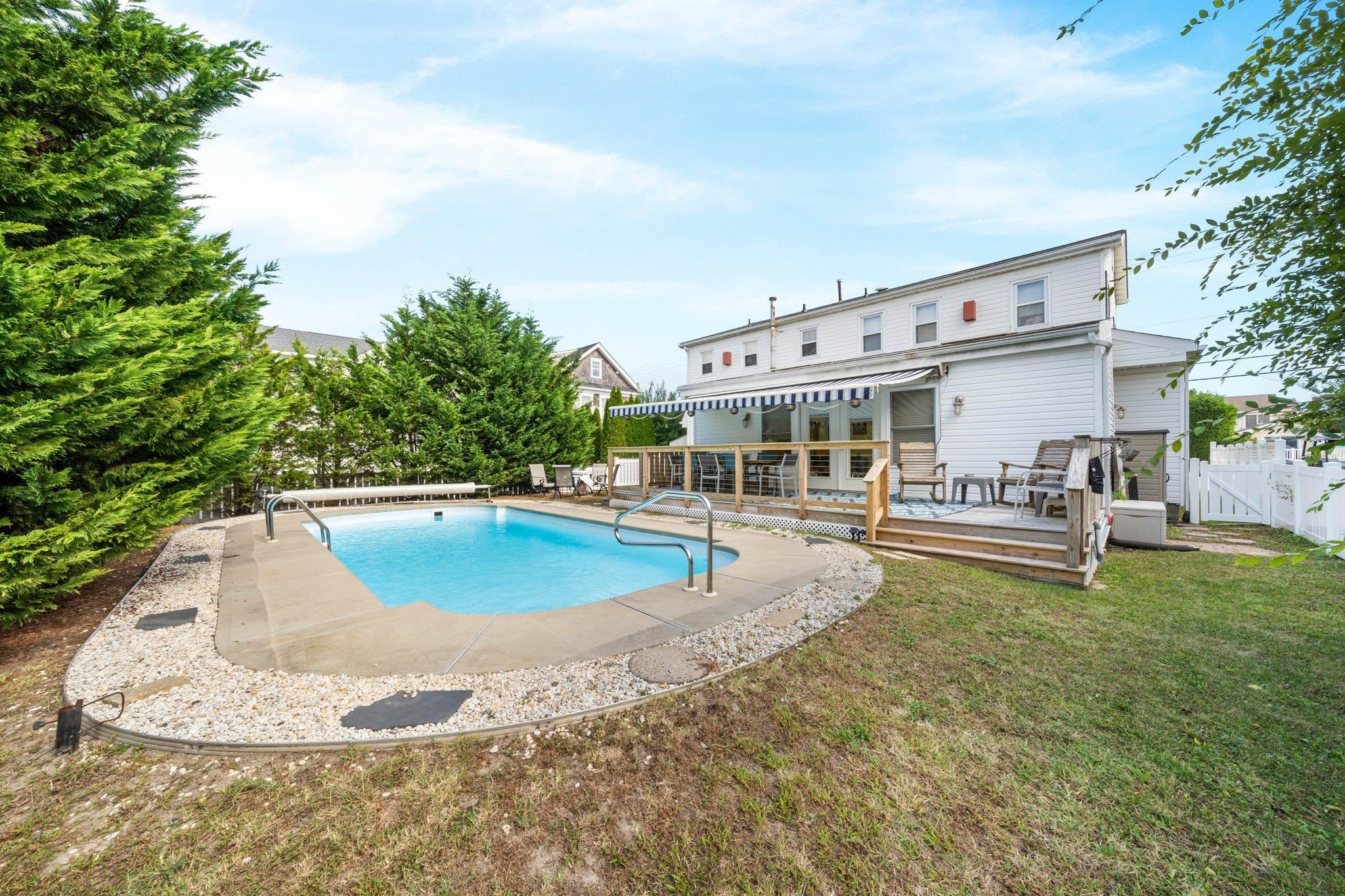 2754 1st Avalon, NJ 08202 - Photo 24 of 26 a view of a swimming pool with chairs