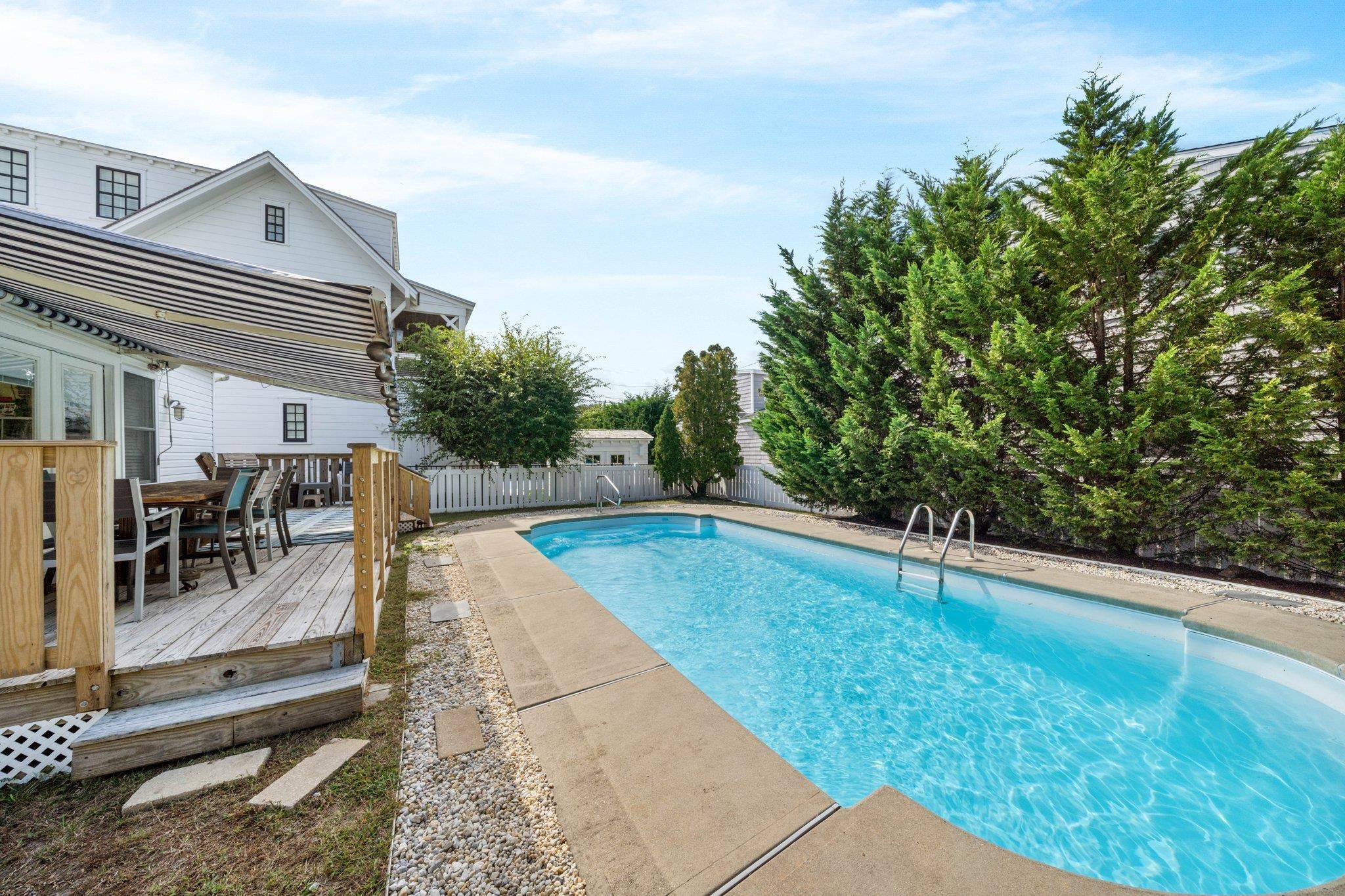 2754 1st Avalon, NJ 08202 - Photo 4 of 26 a view of a swimming pool with an outdoor seating and a garden