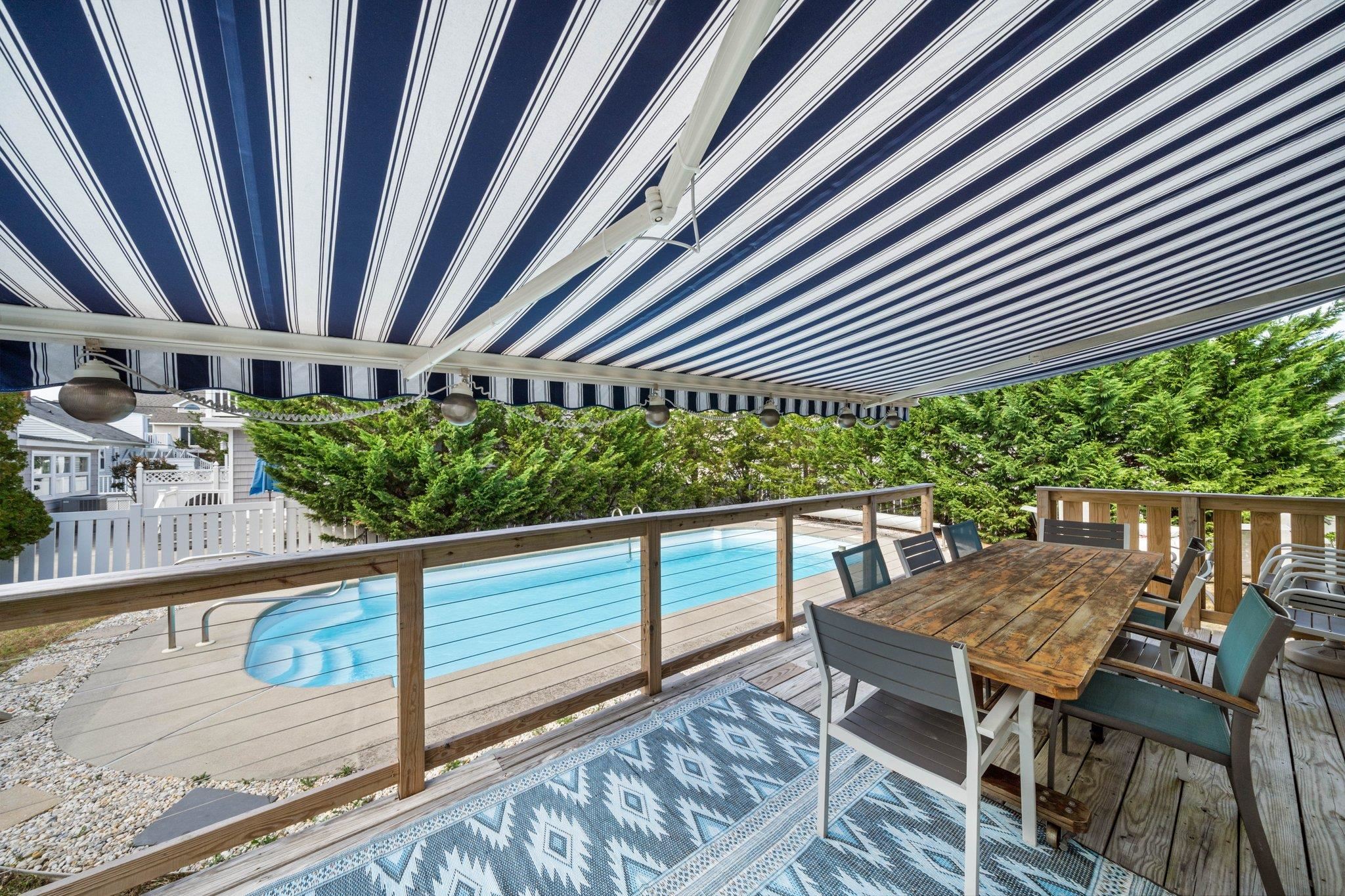 2754 1st Avalon, NJ 08202 - Photo 8 of 26 a view of a chairs and table on the wooden roof deck