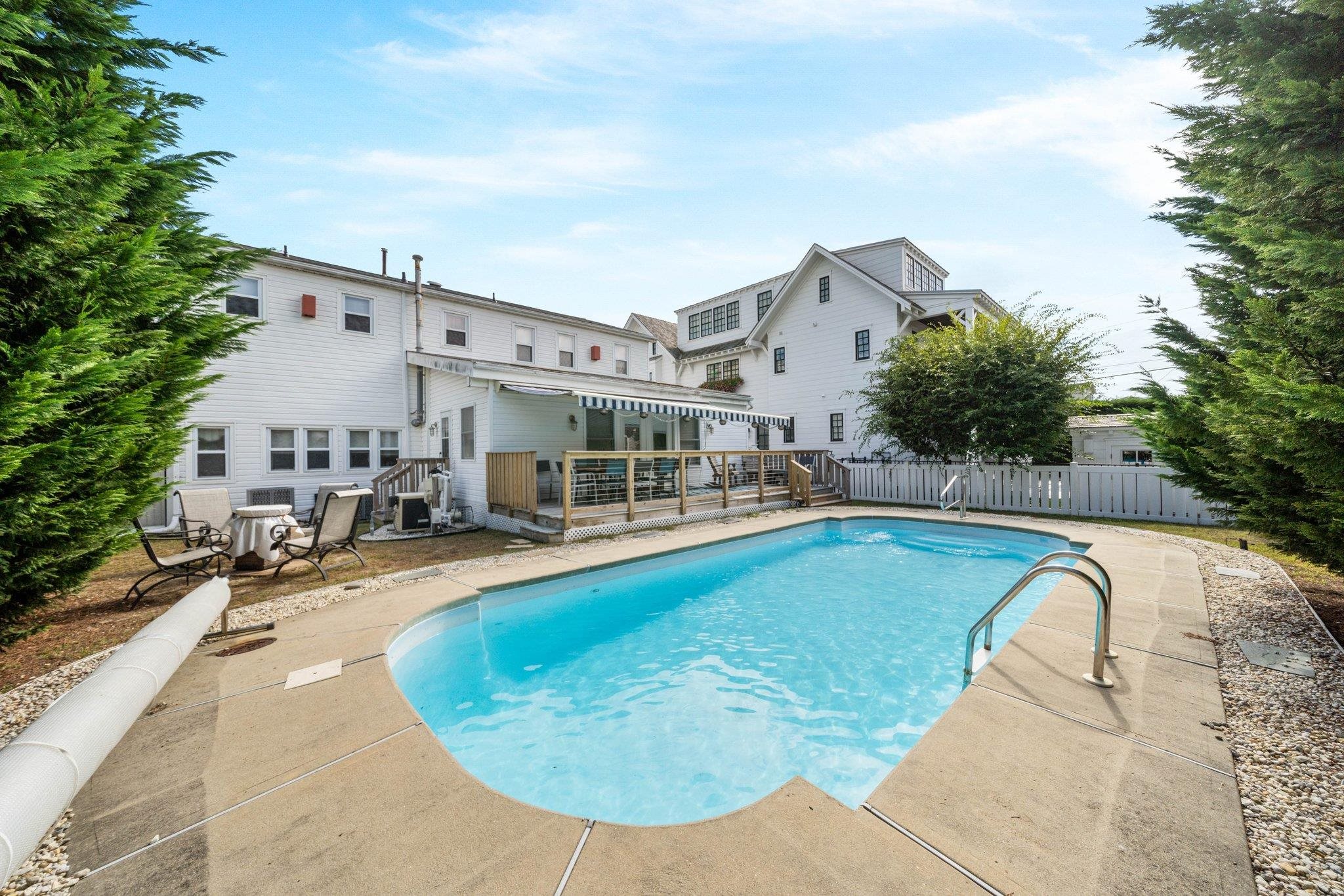 2754 1st Avalon, NJ 08202 - Photo 9 of 26 a swimming pool with outdoor seating and yard