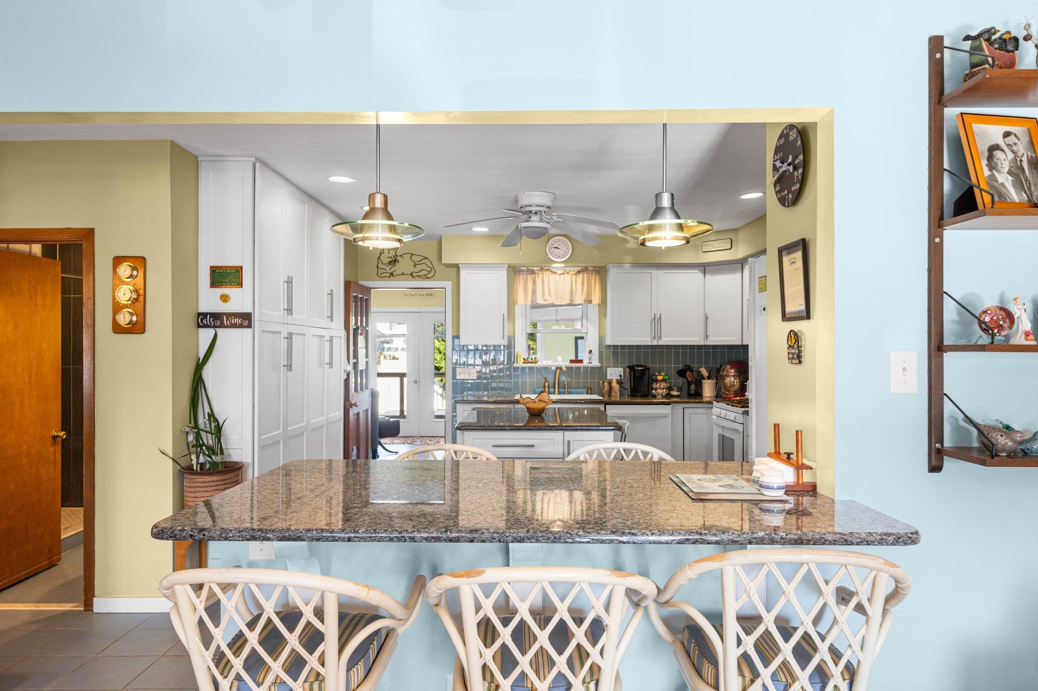 2754 1st Avalon, NJ 08202 - Photo 10 of 26 a kitchen with granite countertop a stove a sink and a dining table