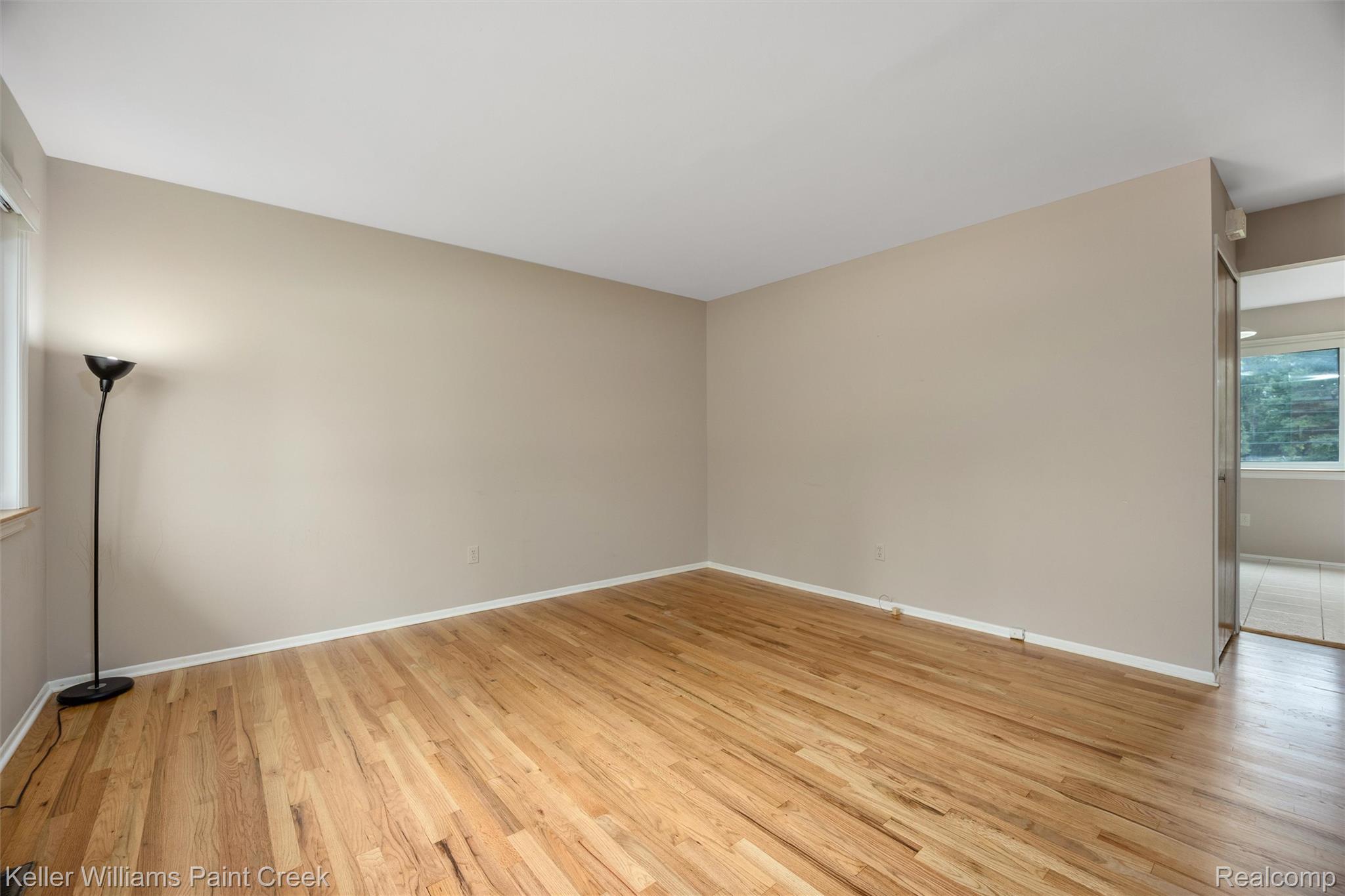 1766 Henry Ruff Road Garden City, MI 48135 - Photo 4 of 36 Hardwood flooring throughout, neutral wall tones, and white trim