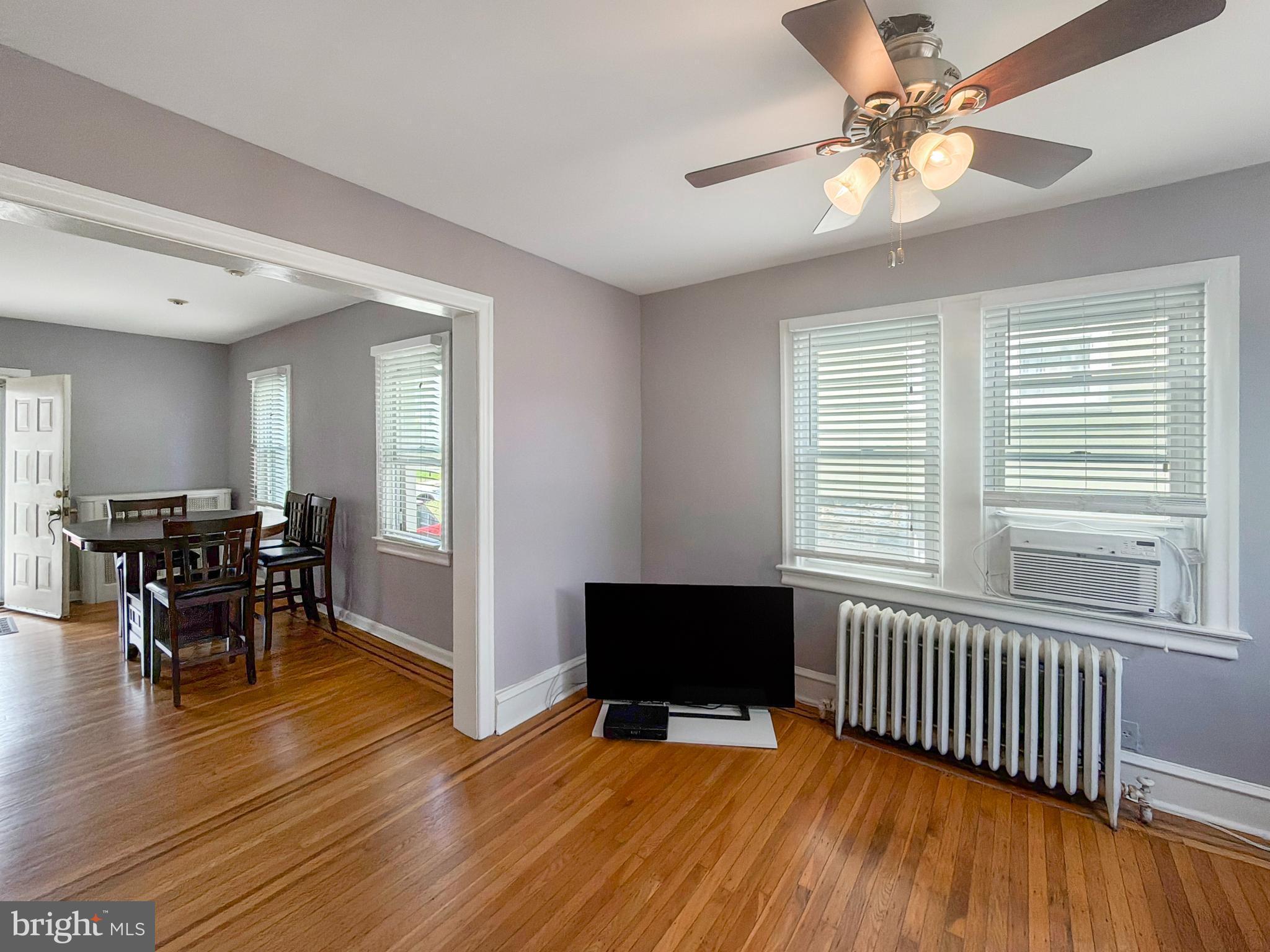 1213 Harding Drive Havertown, PA 19083 - Photo 6 of 25 a view of a dining room with furniture and wooden floor