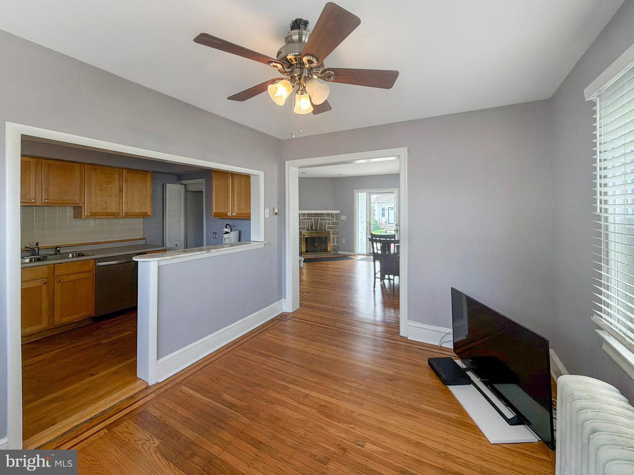 1213 Harding Drive Havertown, PA 19083 - Photo 10 of 25 a kitchen with stainless steel appliances wooden floor and a refrigerator