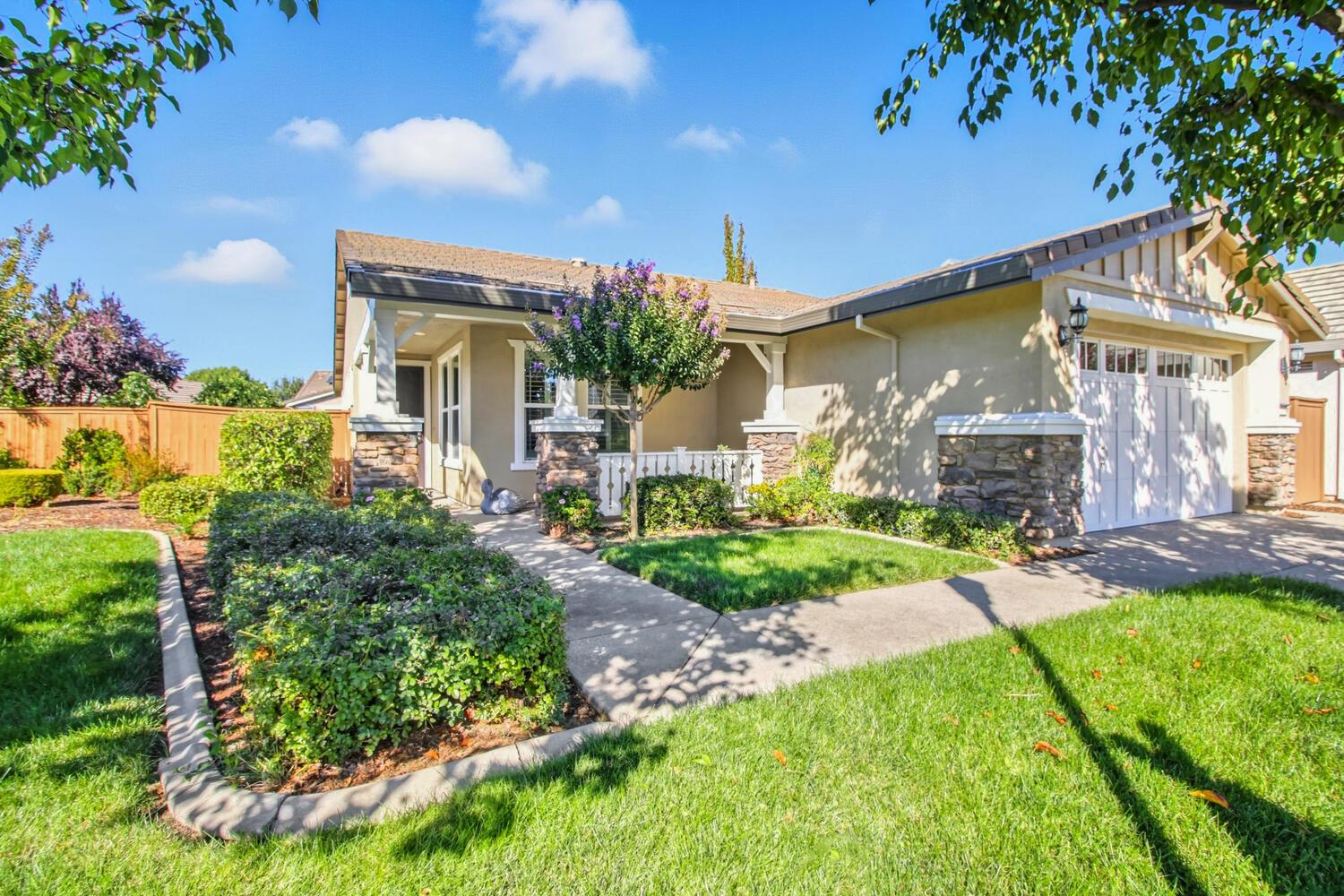 7409 Rothschild Court Elk Grove, CA 95757 - Photo 3 of 62 front view of a house with a yard