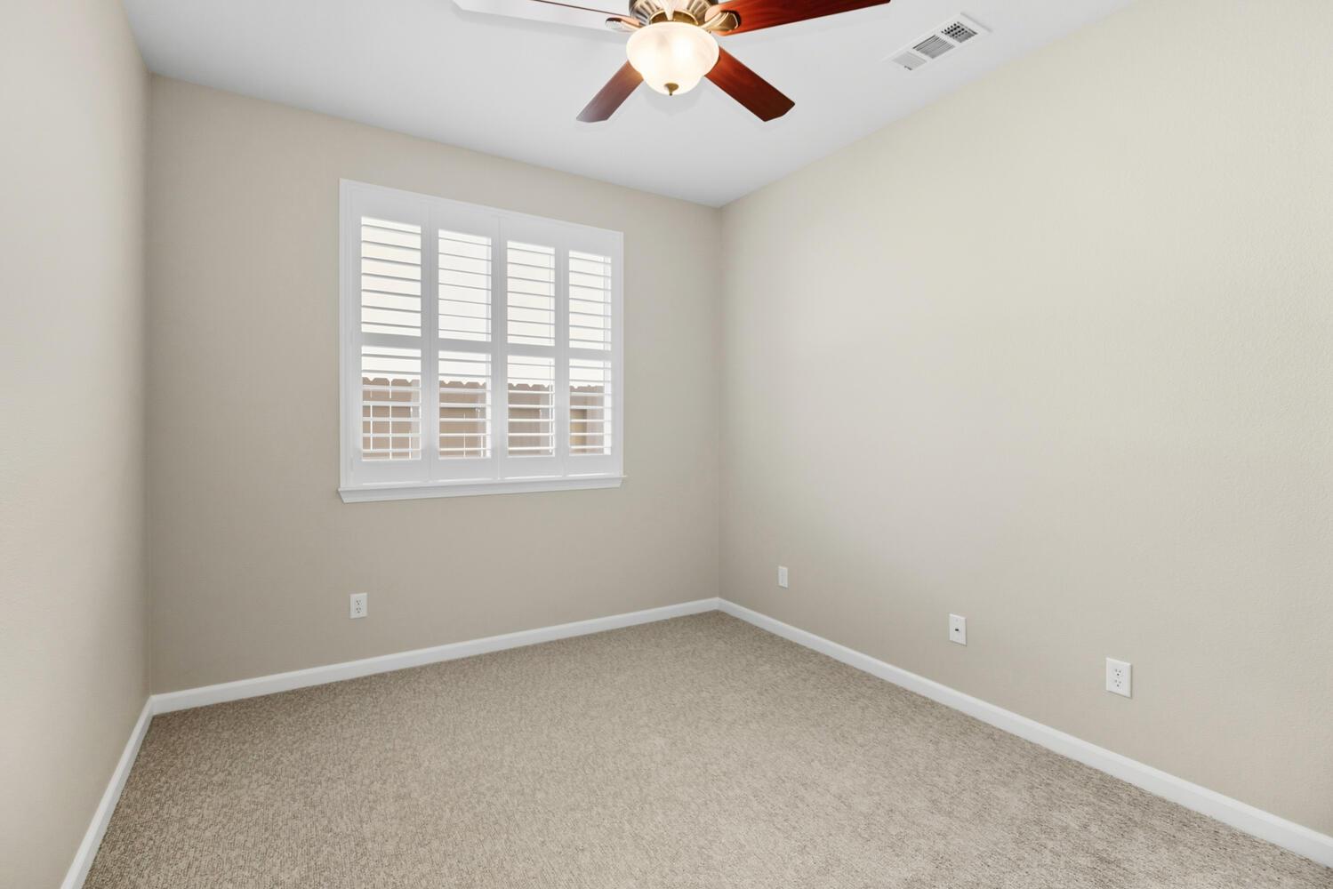 7409 Rothschild Court Elk Grove, CA 95757 - Photo 32 of 62 an empty room with a window and a fan