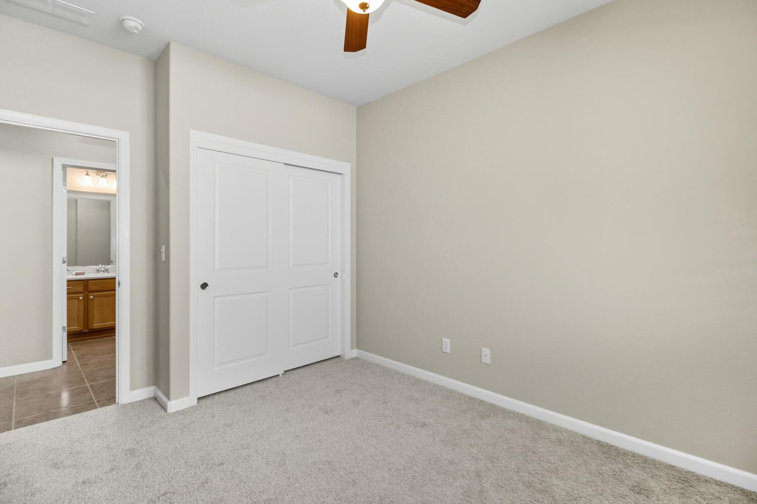 7409 Rothschild Court Elk Grove, CA 95757 - Photo 33 of 62 an empty room with chandelier fan