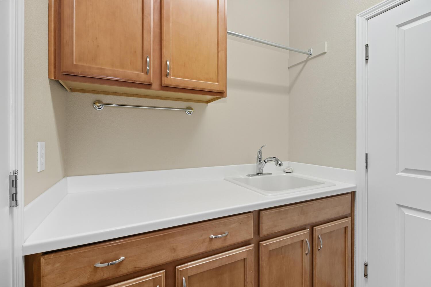 7409 Rothschild Court Elk Grove, CA 95757 - Photo 35 of 62 a bathroom with a sink and a cabinets