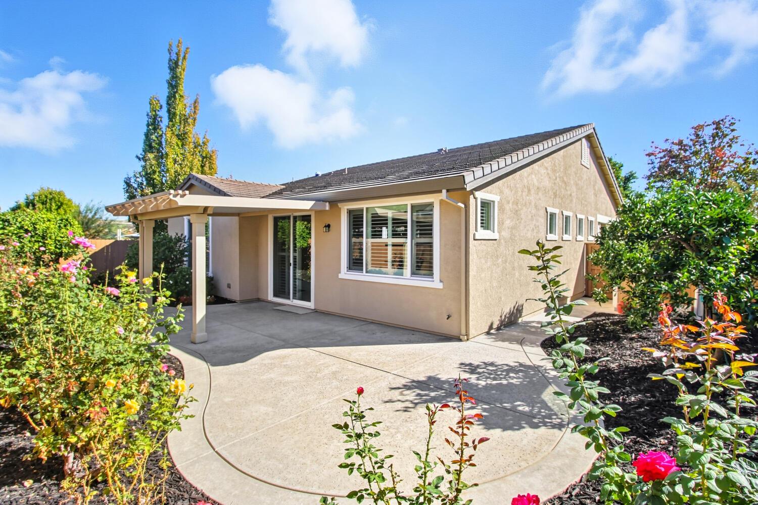 7409 Rothschild Court Elk Grove, CA 95757 - Photo 37 of 62 a front view of a house with a yard