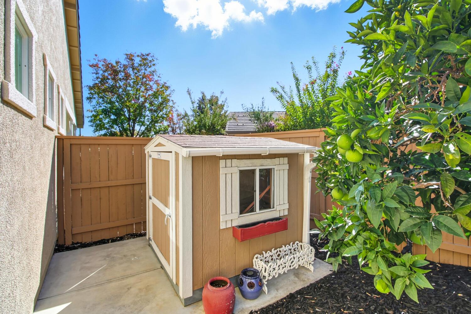 7409 Rothschild Court Elk Grove, CA 95757 - Photo 45 of 62 a front view of a house with garden